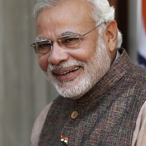 India's Prime Minister Narendra Modi (R) and Afghanistan's President Hamid Karzai smile before start of their meeting in New Delhi May 27, 2014. Modi was sworn in as India's prime minister in an elaborate ceremony at New Delhi's resplendent presidential palace on Monday, after a sweeping election victory that ended two terms of rule by the Nehru-Gandhi dynasty. REUTERS/Adnan Abidi (INDIA - Tags: POLITICS) - RTR3QZVN